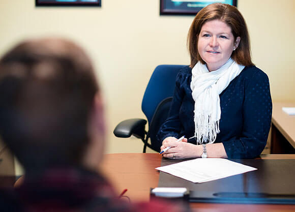 An admissions counselor meets with a prospective student.