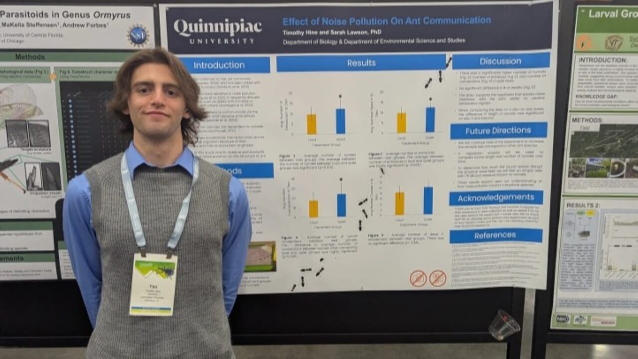 Tim Hine presenting a poster at a conference